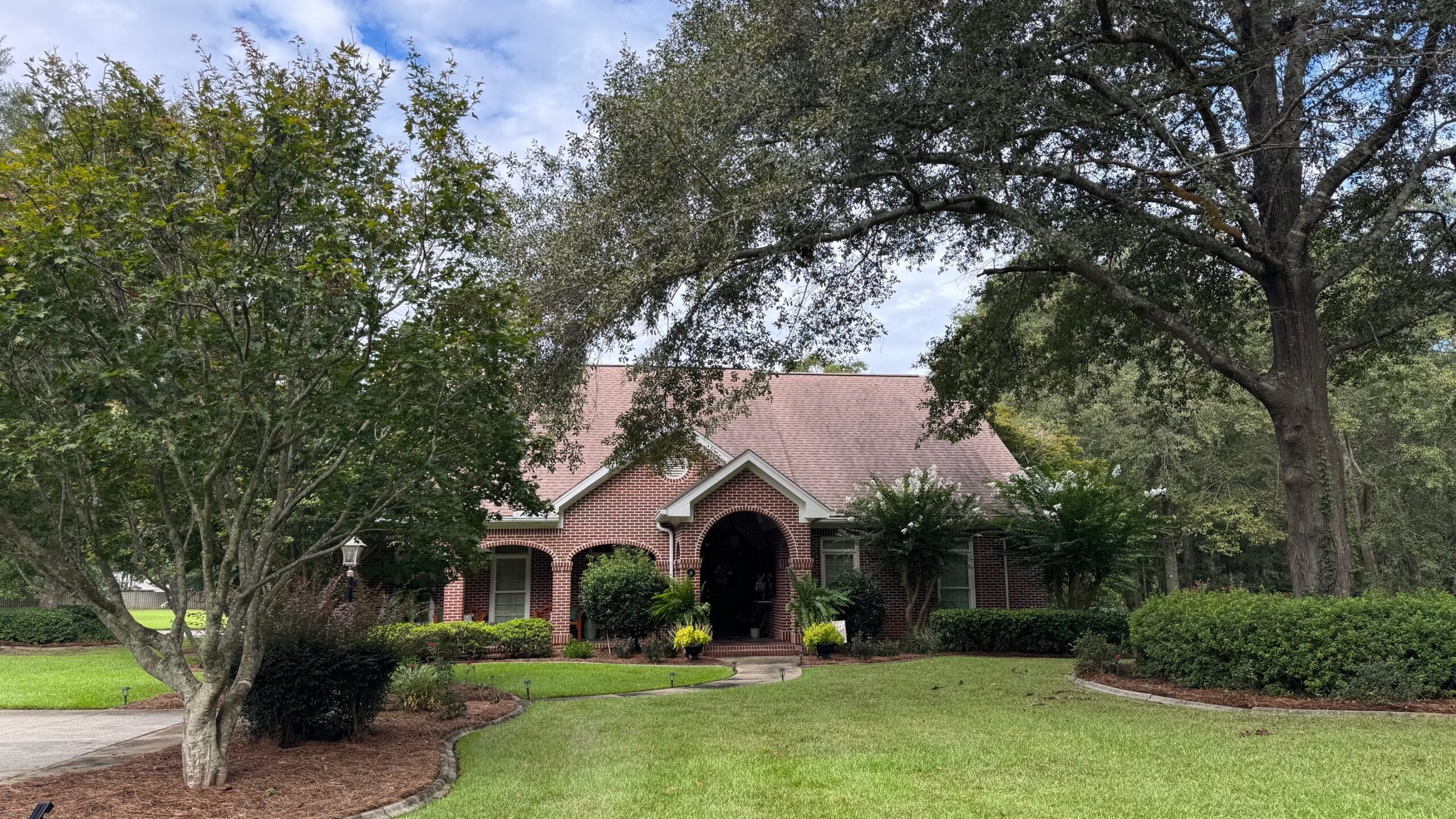 Roofing contractor ozark al — mac construction crew on residential roof dale county alabama