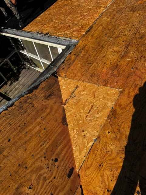 Roof decking at a dormer in Dothan Close-up of tan roof decking at a dormer with white trim on a MAC Construction job in Dothan, Alabama